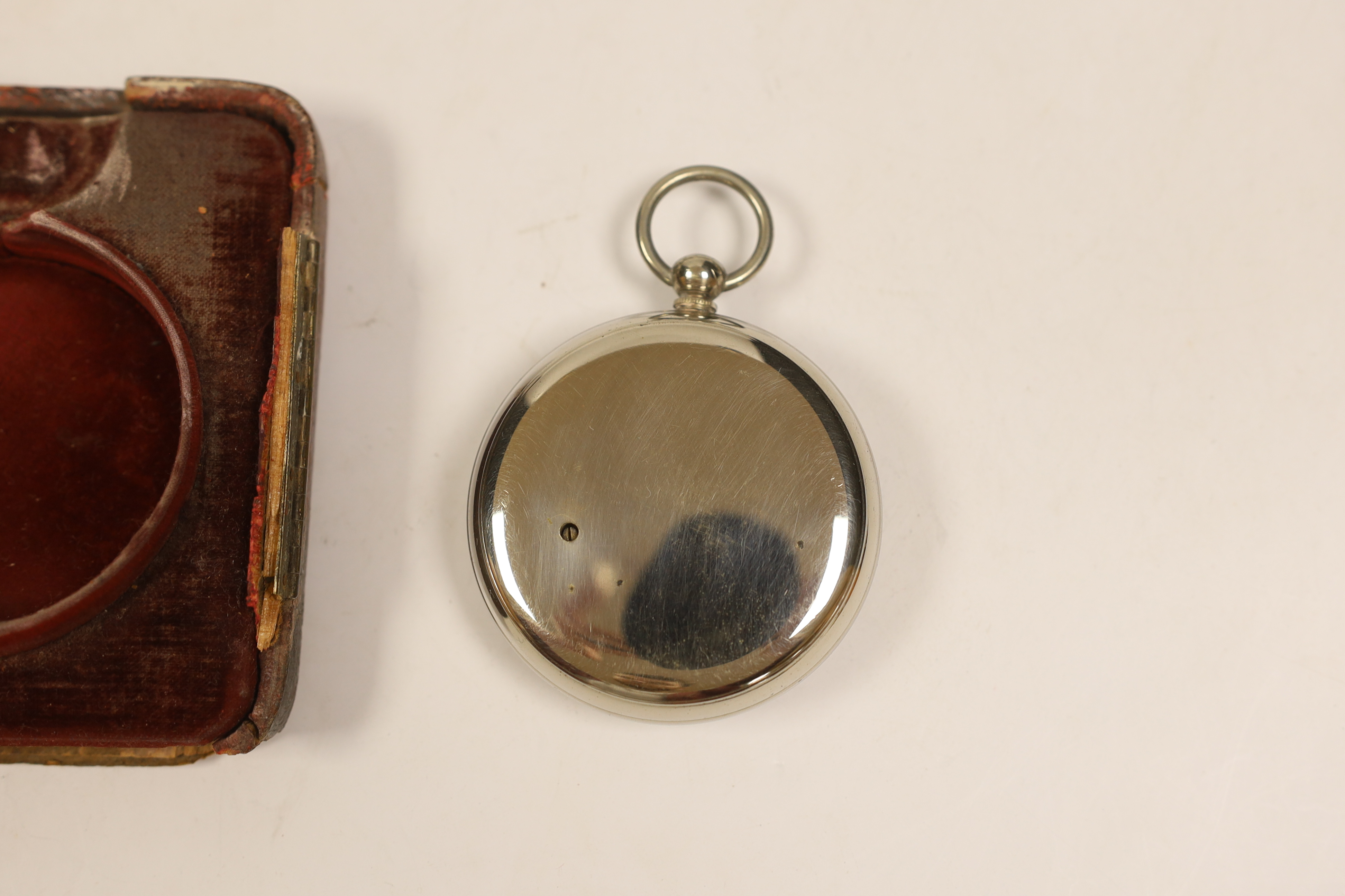 A nickel cased Goliath pocket barometer, in silver mounted travelling case, London, 1897, 11.1cm.